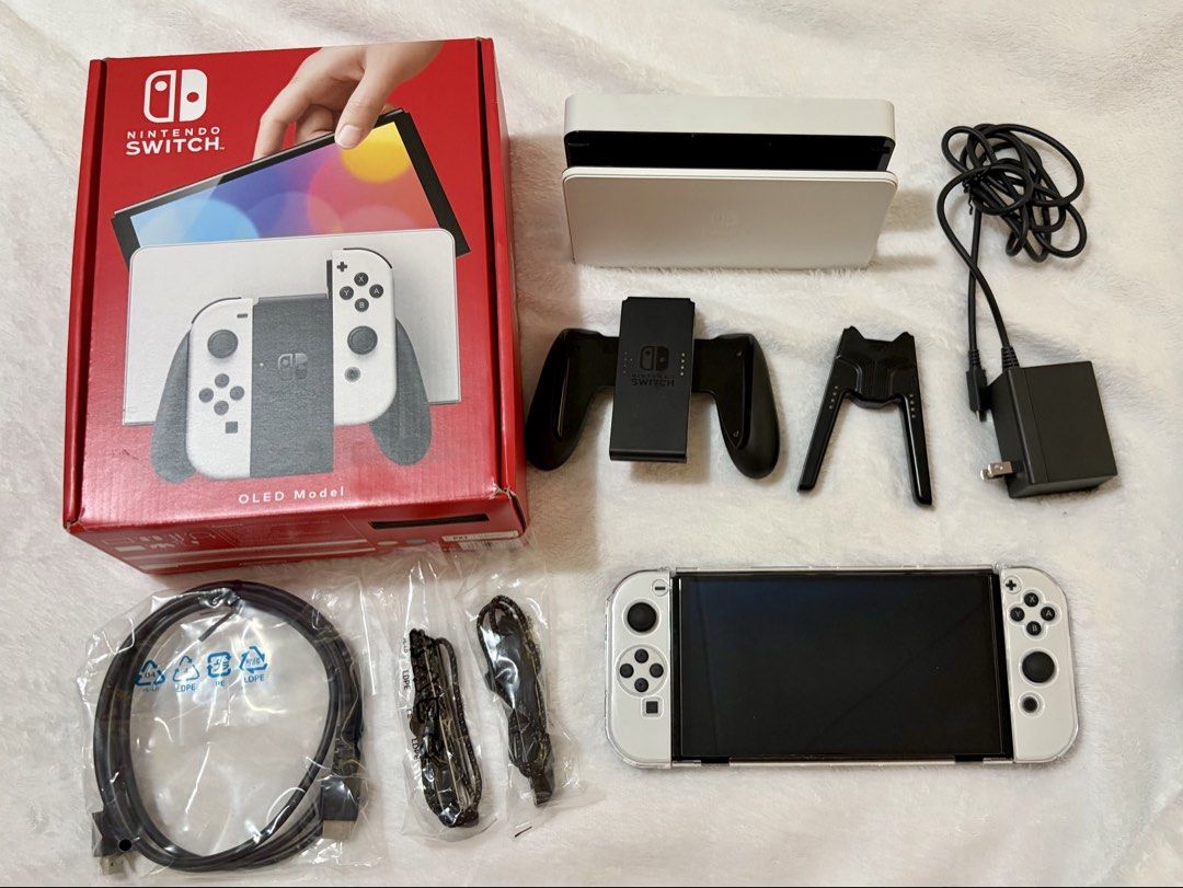 Nintendo Switch OLED Console (White) (Category: Nintendo) located in San Fernando. Submitted by cscg_ (Listing ID 1446835724, Image 1). Description: Nintendo Switch OLED Console (White) - Excellent condition - No issues, fully functional - Bought March 2026 - Complete set w/ original inclusions/accessories - Freebies: Dockable transparent case, tempered glass, and charging controller grip bracket - RFS: Rarely used Also available: SanDisk Extreme