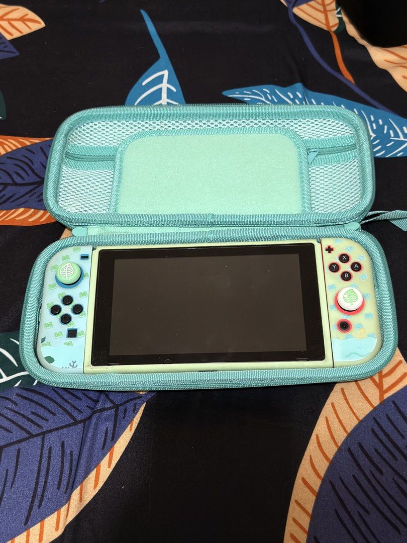 Nintendo Switch V2 w/ 128GB SD Card (Category: Nintendo) located in Quezon City. Submitted by safedolphin.117802 (Listing ID 1446803191, Image 2). Description: Nintendo Switch v2 w/ 128GB SD Card Inclusions: Original Box Switch V2 console Dock HDMI cable Charger Animal Crossing Joy-Con skin and caps 2 carrying cases Digital Games (Primary) - Overcooked Eat All You Can! - Mortal Kombat 11 - Hades - God Eater 3 - 13 Sentinels Aegis Rim - Danganronp