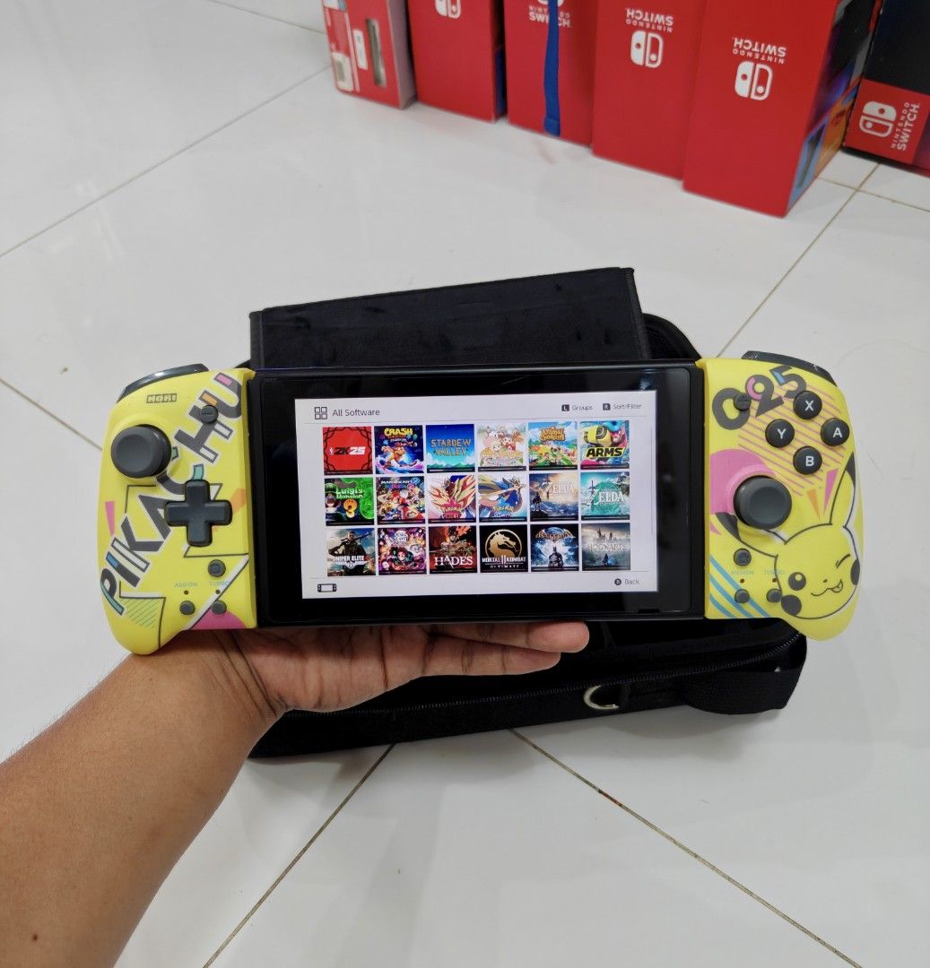Nintendo Switch V2 with Free Games (Category: Nintendo) located in Manila. Submitted by nswitchgear (Listing ID 1446774313, Image 2). Description: Nintendo Switch V2 with Free Games ₱8,499 FREE acess to my Paid games Legit purchase not Jailbreak. Used item but in Good/Best condition Can give 7 Days personal Warranty for peace of mind. -Doon po tayo sa kaya tayong issupport, dont settle for less. Replace Joycon with Limited Pikachu Hori Splitpad(m