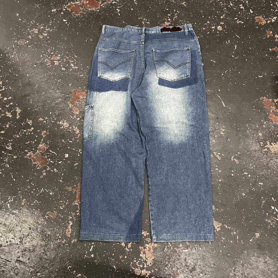 Pelle Pelle Patchwork Baggy Denim Jeans (Category: Jeans) located in Cagayan de Oro. Submitted by sumamestreethub (Listing ID 1446738859, Image 2). Description: - Baggy fit Pelle Pelle jeans - Blue wash with unique patchwork details - Embroidered logo on the front pocket - Convenient side cargo pocket - Cool Y2K streetwear vibe W-36 L-42 T-14 H-9.5.