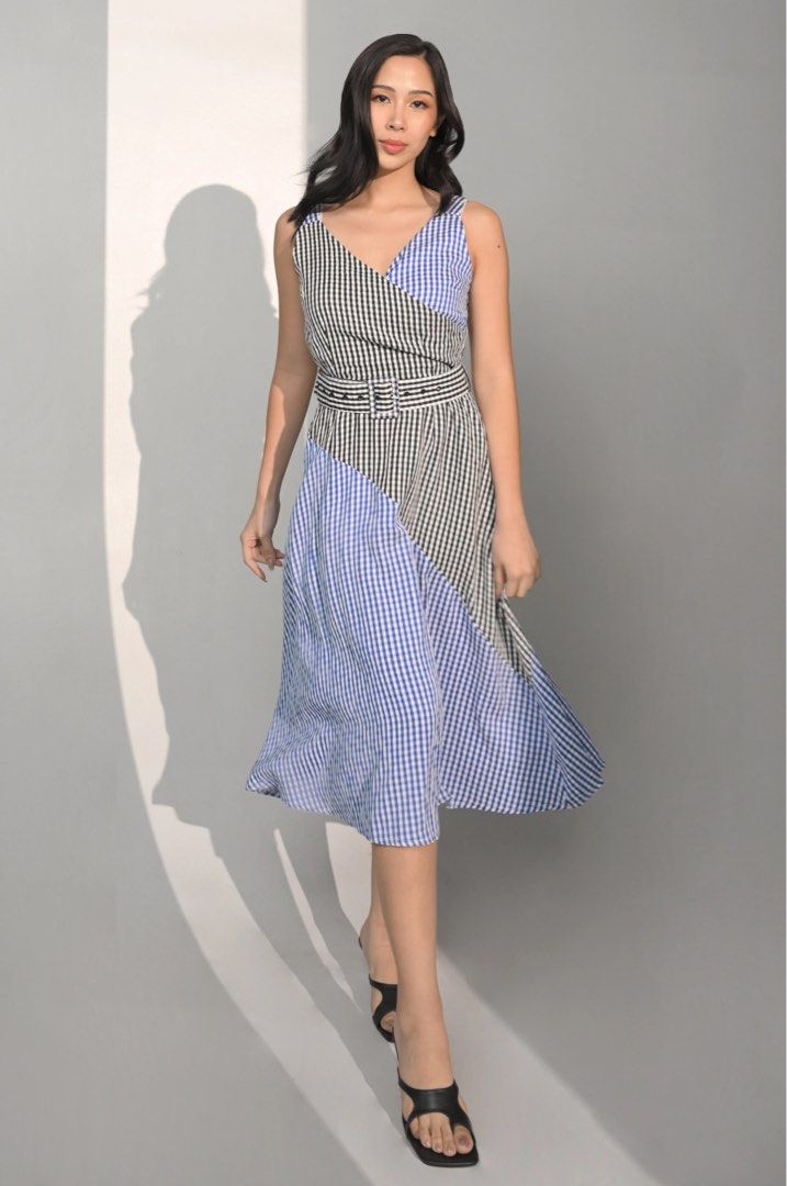 Plains and Prints Patchwork Gingham Wrap Midi Dress with Belt (Category: Dresses) located in Quezon City. Submitted by sdldeclutter (Listing ID 1446800052, Image 1). Description: - Asymmetrical patchwork midi dress - Features a black, white, and blue gingham pattern - V-neckline with a flattering wrap front - Sleeveless design - Includes a matching fabric belt - Skirt has a slight flare for a graceful silhouette - Ideal for casual days, picnics, 