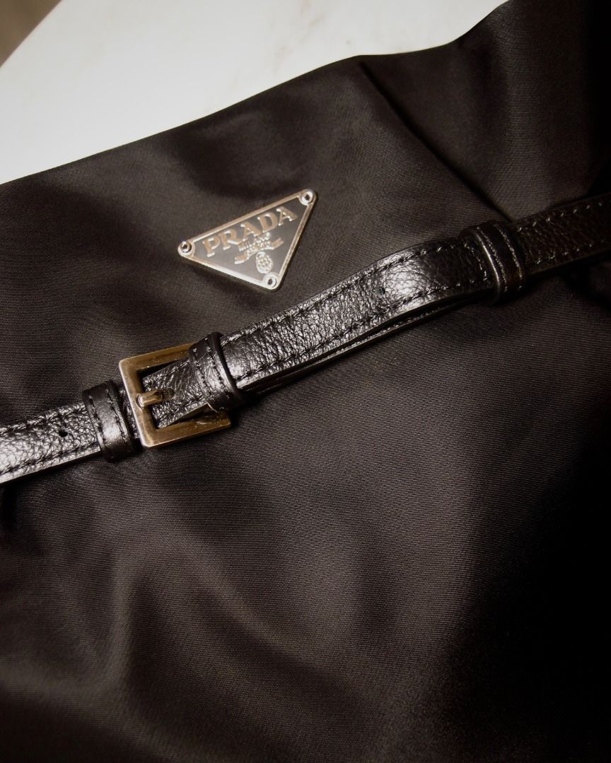 Prada Black Nylon Belted Shoulder Bag (Category: Luxury Bags & Wallets) located in Manila. Submitted by wear.aureve (Listing ID 1446822249, Image 2). Description: Pr*da Nylon Belted Bucket Bag quality: 10/10 (excellent condition) source: 🇯🇵 Highlights: * like new condition * no signs of wear * no scratches * clean overall * comes with bag straps and all bag inclusions Reminder: - Color may vary due to lighting - Authentic Prada shoulder bag - M
