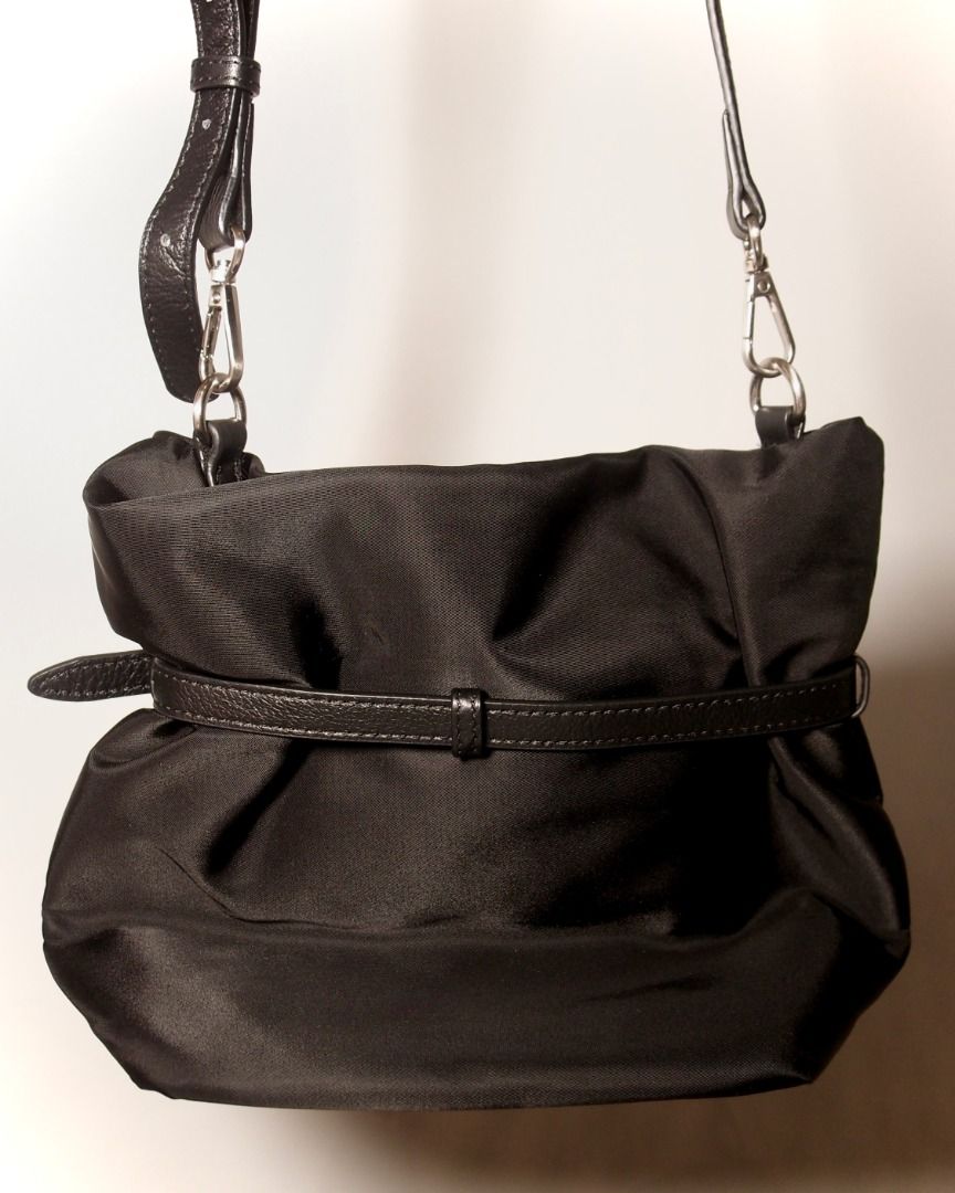 Prada Black Nylon Belted Shoulder Bag (Category: Luxury Bags & Wallets) located in Manila. Submitted by wear.aureve (Listing ID 1446822249, Image 3). Description: Pr*da Nylon Belted Bucket Bag quality: 10/10 (excellent condition) source: 🇯🇵 Highlights: * like new condition * no signs of wear * no scratches * clean overall * comes with bag straps and all bag inclusions Reminder: - Color may vary due to lighting - Authentic Prada shoulder bag - M