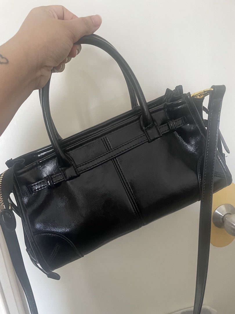 Prada Black Patent Leather Top Handle with sling Bag (Category: Luxury Bags & Wallets) located in Quezon City. Submitted by simply_closet (Listing ID 1446901176, Image 2). Description: Japan preloved! good as new Gcash or thru bank transfer Ship thru lalamove or lbc.