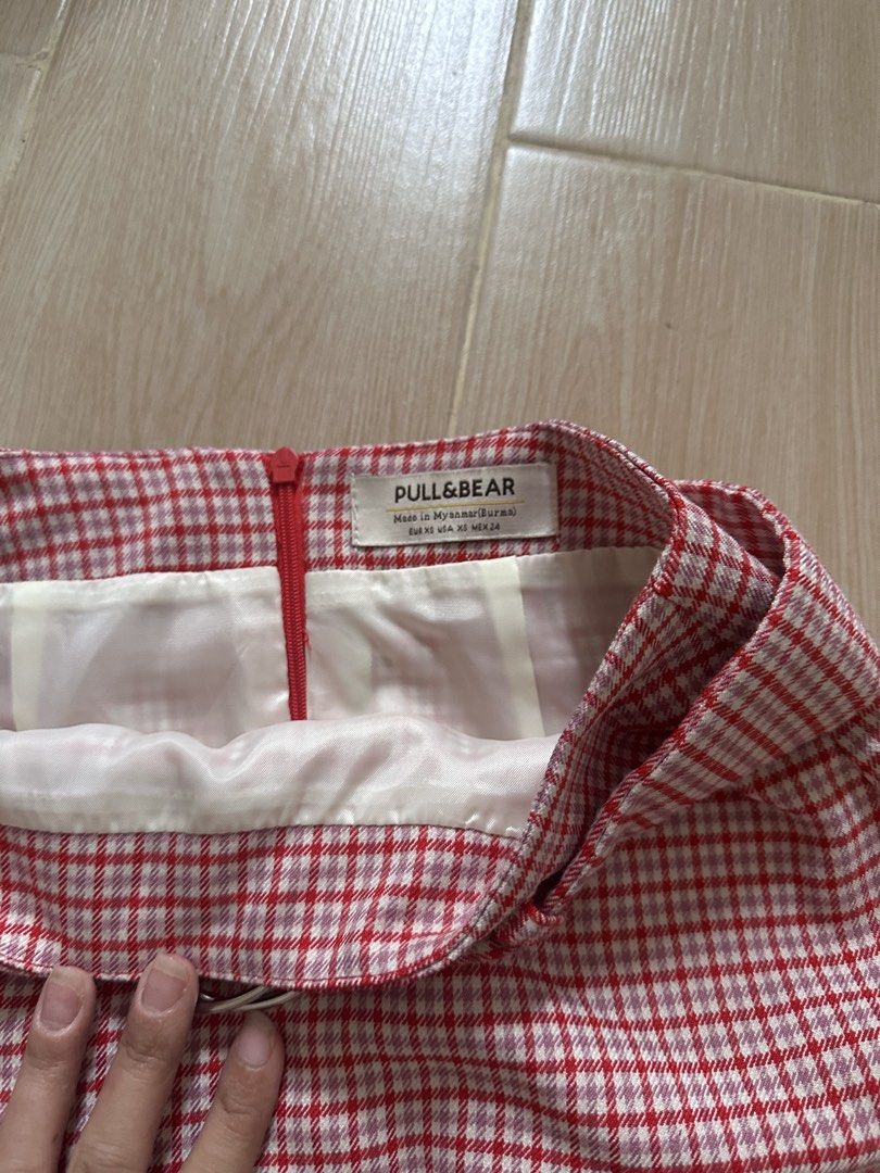 Pull & Bear Red Plaid Mini Skirt with Belt (Category: Skirts) located in Antipolo. Submitted by waco1313 (Listing ID 1446755841, Image 2). Description: - Cute red and white plaid mini skirt - Includes matching belt with silver buckle - Zipper closure at the back - Versatile for casual or night out looks.