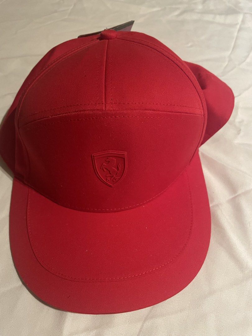 Original Puma Ferrari Red Cap - RUSH (Category: Caps & Hats) located in Taguig. Submitted by vast_charmmie (Listing ID 1446782307, Image 1). Description: - Authentic red Puma cap - Features iconic Ferrari logo - Adjustable strap for a comfortable fit - Brand new with tags attached - Ideal gift.