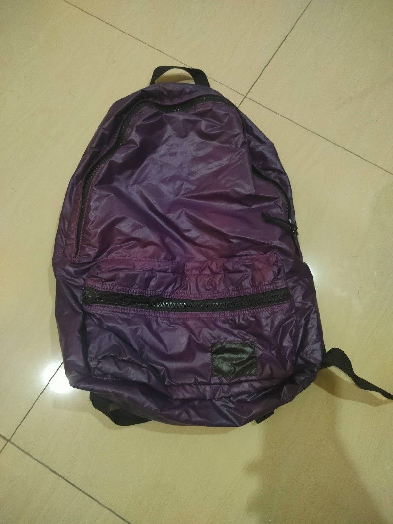 Purple Nylon Backpack (Category: Backpacks) located in Ampang. Submitted by daushhh (Listing ID 1446832762, Image 1). Description: - Lightweight purple backpack - Main compartment and front zip pocket - Pink fabric interior lining - Adjustable straps - Ideal for everyday use or travel - Folds up small for easy storage.