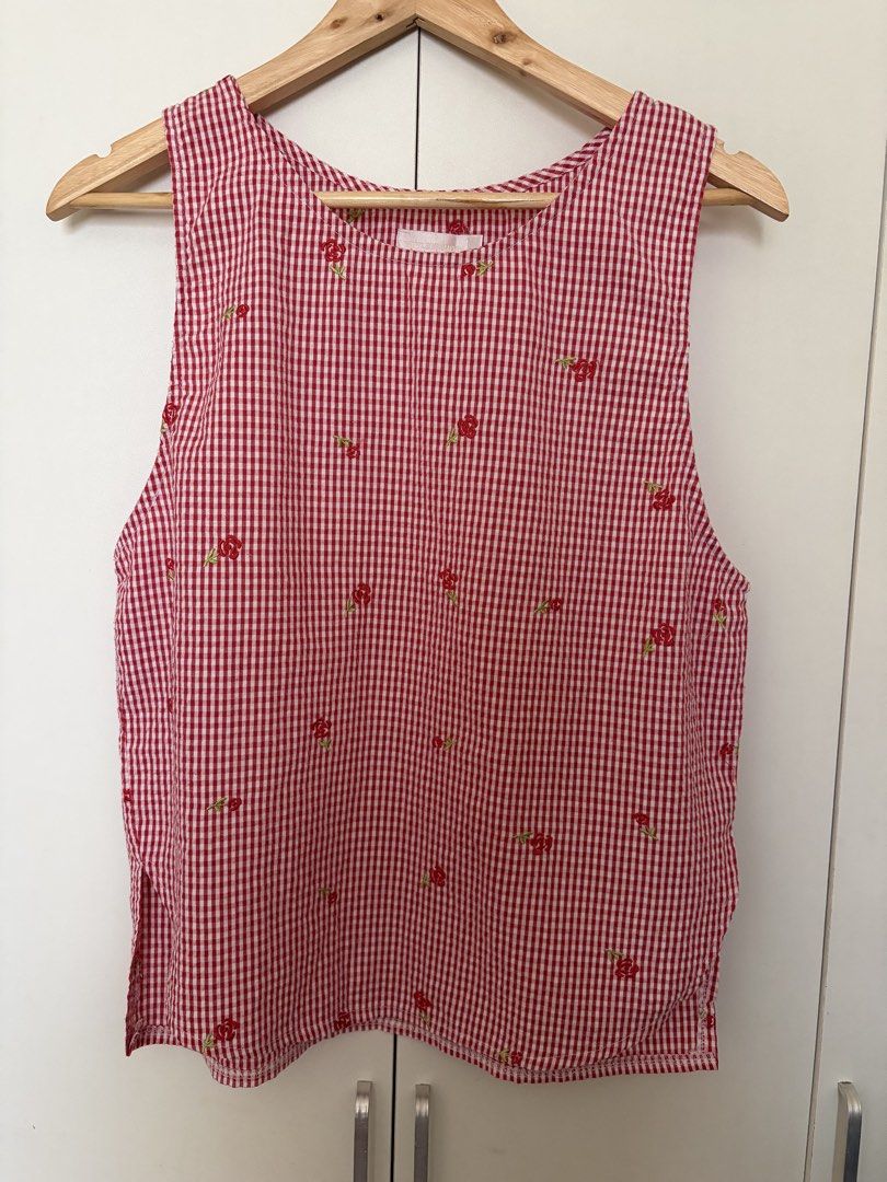 Red Gingham Floral Embroidered Sleeveless Top (Category: Sleeveless) located in Caloocan City. Submitted by welareg (Listing ID 1446800079, Image 1). Description: - Cute red gingham sleeveless top - Adorable all-over little red floral embroidery - Features side slits for a relaxed and comfortable fit - Versatile: pairs perfectly with jeans or shorts - Ideal for a casual day out.