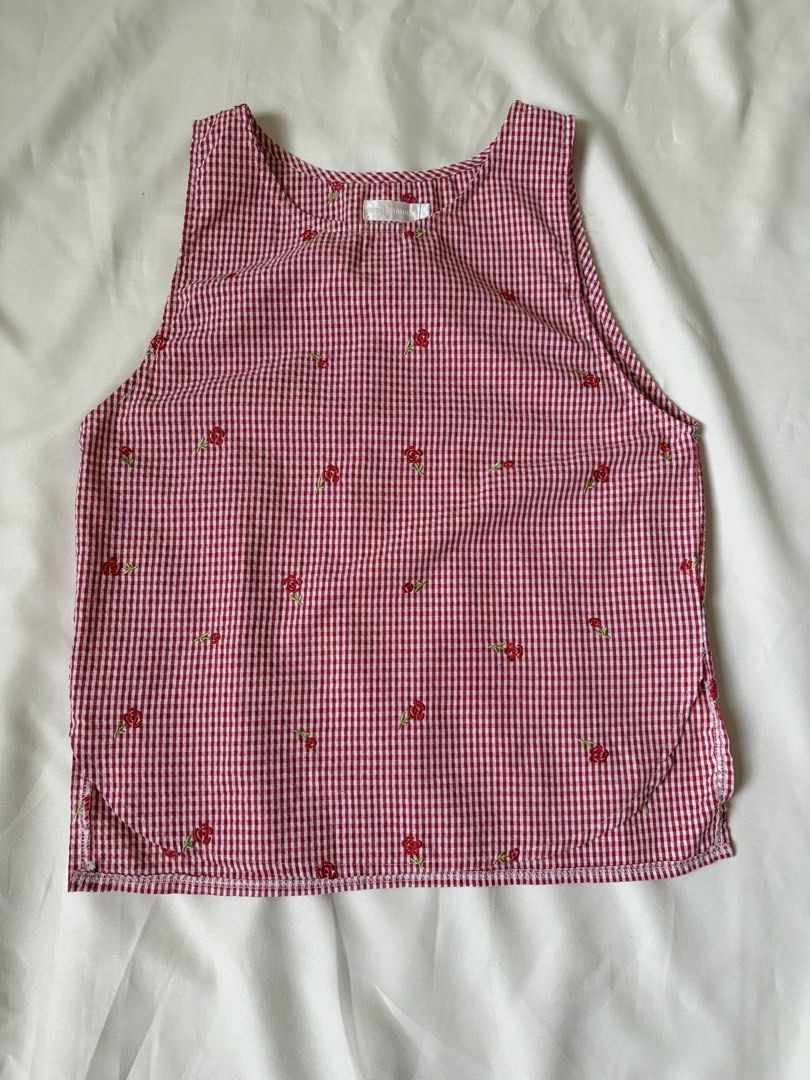 Red Gingham Floral Embroidered Sleeveless Top (Category: Sleeveless) located in Caloocan City. Submitted by welareg (Listing ID 1446800079, Image 2). Description: - Cute red gingham sleeveless top - Adorable all-over little red floral embroidery - Features side slits for a relaxed and comfortable fit - Versatile: pairs perfectly with jeans or shorts - Ideal for a casual day out.