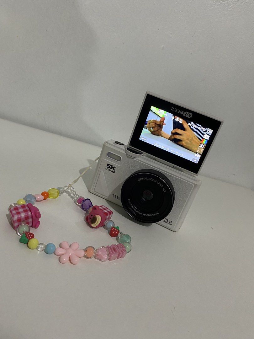 RETRO 5K Ultra HD Digital Camera Charm Strap (Category: Cameras) located in Bamban. Submitted by keenwolf_208f71 (Listing ID 1446722909, Image 3). Description: - White Retro digital camera - Records in stunning 5K Ultra HD - 18x digital zoom capability - Flip-up screen for easy viewing and selfies - Ideal for capturing precious memories - Ready for its new owner!.