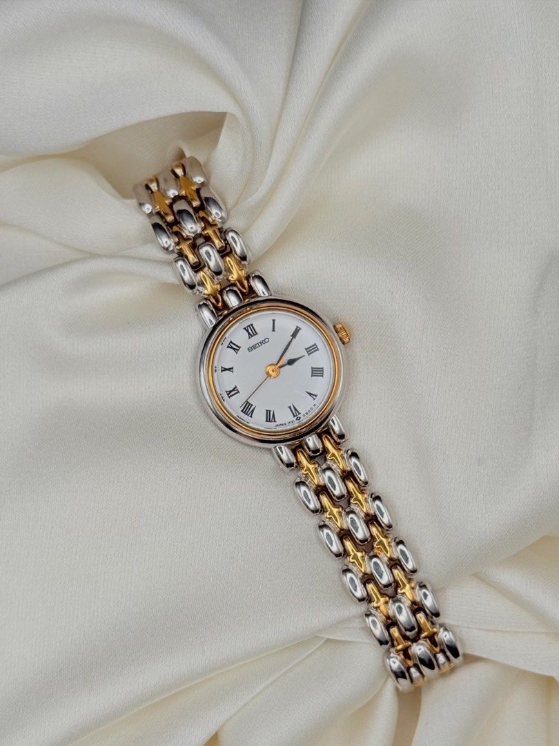 Seiko Classic Roman Two Toned Watch (Category: Women's Watches) located in Lipa City. Submitted by watchoutph (Listing ID 1446826588, Image 2). Description: Seiko Classic Dainty Two-toned Watch White Dial Roman Indices Royal spade hands Silver round case with gold ring bezel Elegant Quartz 25mm 16.3cm wrist size ₱8,500.