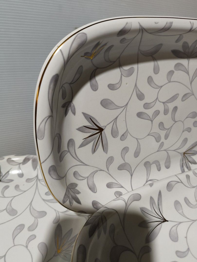 Set of 5 Rectangular ceramic serving platters with Floral Design (Category: Dinnerware & Cutlery) located in Muntinlupa City. Submitted by mcjek1026 (Listing ID 1446727311, Image 3). Description: - Set of 5 rectangular ceramic serving platters - Lovely grey and white floral pattern with gold trim - Ideal for serving snacks, appetizers, or desserts - Perfect for parties or everyday use - Approximate dimensions: 10" x 6.5" .