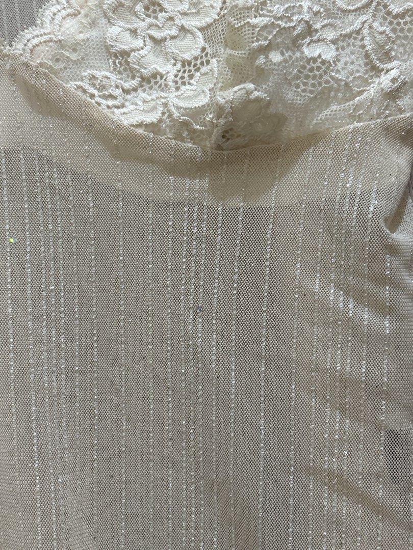 Sheer Lace Trim Camisole Top (Category: Sleeveless) located in Mandaluyong City. Submitted by izz_iya (Listing ID 1446775702, Image 3). Description: - price negotiable - Cream colored camisole - Sheer, sparkly fabric - Adjustable straps for a customized fit - Estimated size: Medium -bought from vintage/thrift ig stores -rfs: I wasn’t able to use it for an event/declutterring .