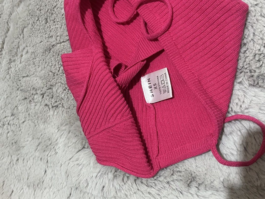 SHEIN Ribbed Knit Crop Top (Category: Others Tops) located in Manila. Submitted by acbdacbd (Listing ID 1446887223, Image 2). Description: - Pink ribbed knit crop top from SHEIN - Features spaghetti straps and a V-neckline - Stretchy material for comfort - Adjustable tie-back closure - Versatile for layering or wearing solo.
