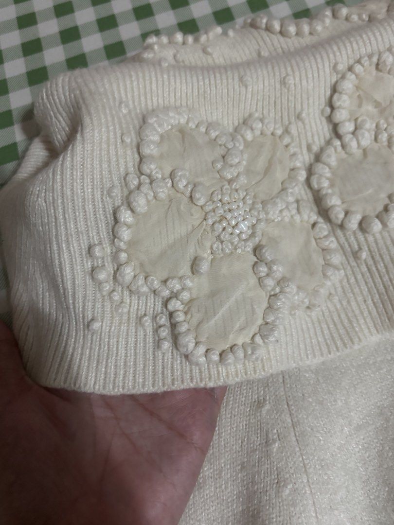 (s-m) cream off-shoulder sweater with beads (Category: Longsleeves) located in Paranaque City. Submitted by prelovedtinez (Listing ID 1446853978, Image 3). Description: - has 3d flower embellishments on the neckline - can fit up to semi L (bust 34) but medyo bitin na sa arms. letting it go for this reason kahit super cute niya.