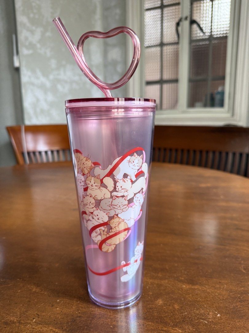 Starbucks Cat Cold Cup (Category: Water Bottles & Tumblers) located in Manila. Submitted by ninisegisss (Listing ID 1446808806, Image 1). Description: - Pink iridescent tumbler - Adorable heart design filled with cats - Comes with a matching pink heart-shaped straw - Ideal for iced beverages - A must-have for cat enthusiasts.