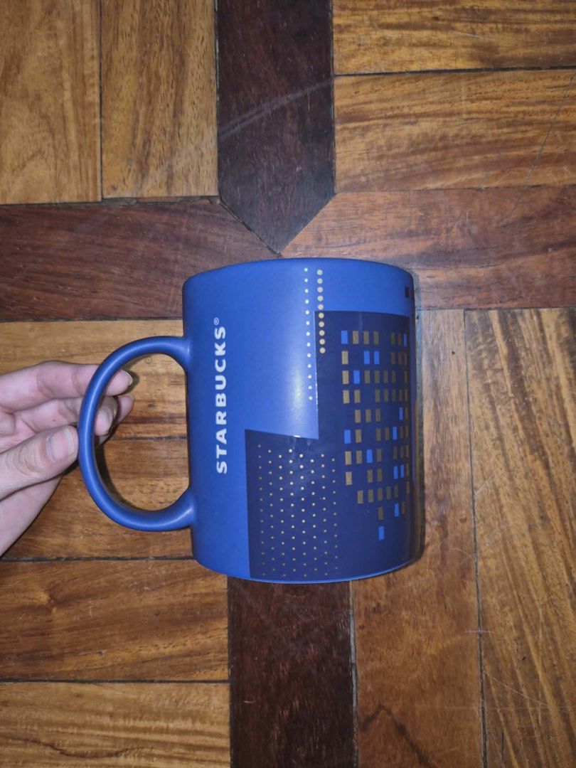 Starbucks Luzon Cityscape Mug (Category: Coffee & Tea Tableware) located in Caloocan City. Submitted by ryan007ong (Listing ID 1446852581, Image 1). Description: - Starbucks mug from Luzon - Features a blue cityscape design with gold accents - Ideal for your morning coffee or tea - A must-have collectible for Starbucks fans.