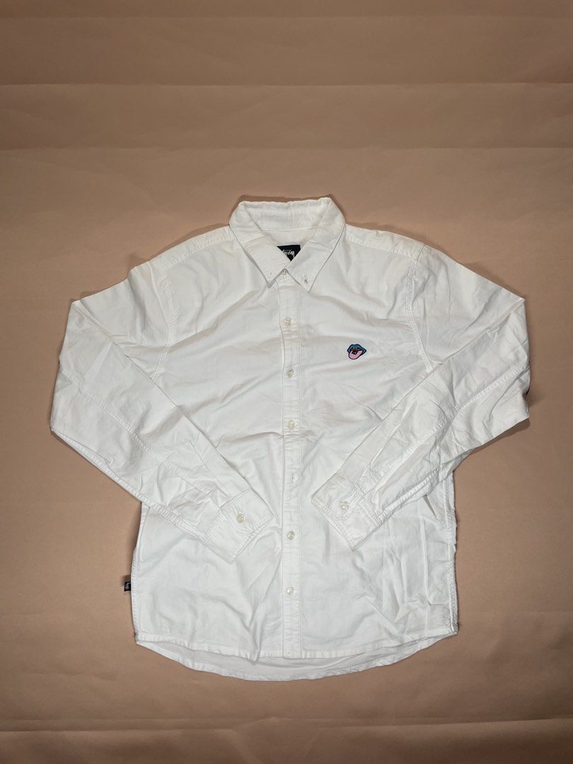 Stüssy white long-sleeve button-down shirt. (Category: Coats, Jackets and Outerwear) located in Legazpi City. Submitted by i.zsnagged (Listing ID 1446823961, Image 1). Description: Dimes:28x21 Size: MEDIUM Color rate: 9/10 Conditon EXCELLENT .