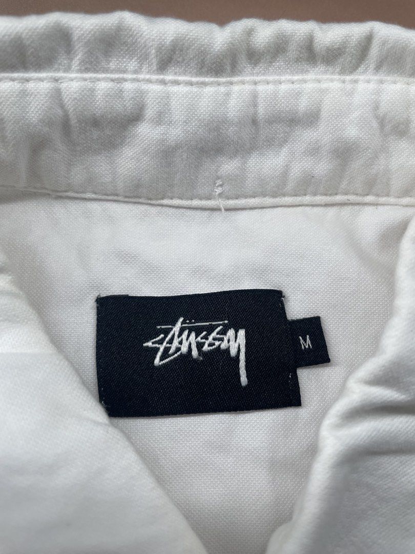 Stüssy white long-sleeve button-down shirt. (Category: Coats, Jackets and Outerwear) located in Legazpi City. Submitted by i.zsnagged (Listing ID 1446823961, Image 3). Description: Dimes:28x21 Size: MEDIUM Color rate: 9/10 Conditon EXCELLENT .
