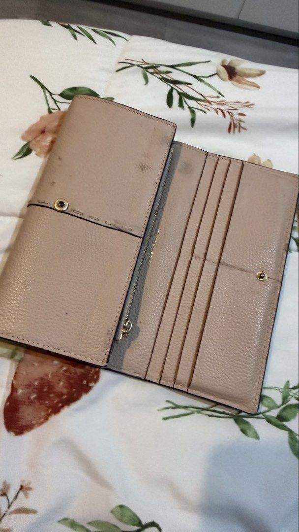 Tory Burch Pink Leather Trifold Wallet (Category: Wallets & Card holders) located in Mandaluyong City. Submitted by stuffnmore (Listing ID 1446850278, Image 2). Description: - Authentic Tory Burch pink leather trifold wallet - Multiple card slots for organization - Secure zippered compartment for coins or essentials - Minor marks inside, as pictured - needs cleaning.