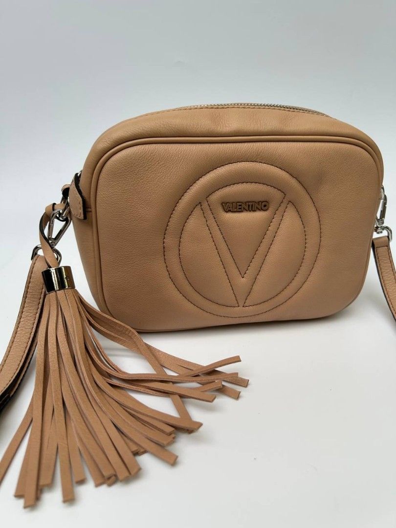 Valentino Cross Body Bag (Category: Luxury Bags & Wallets) located in Quezon City. Submitted by cornelle_luxuryph (Listing ID 1446750346, Image 1). Description: 💕 Valentino by Mario Valentino crossbody bag - Mia Sauvage model Color - beige Condition: 9/10, Excellent Inclusion: long strap Price: 8,800 pesos only 100% authentic | Money back guarantee.