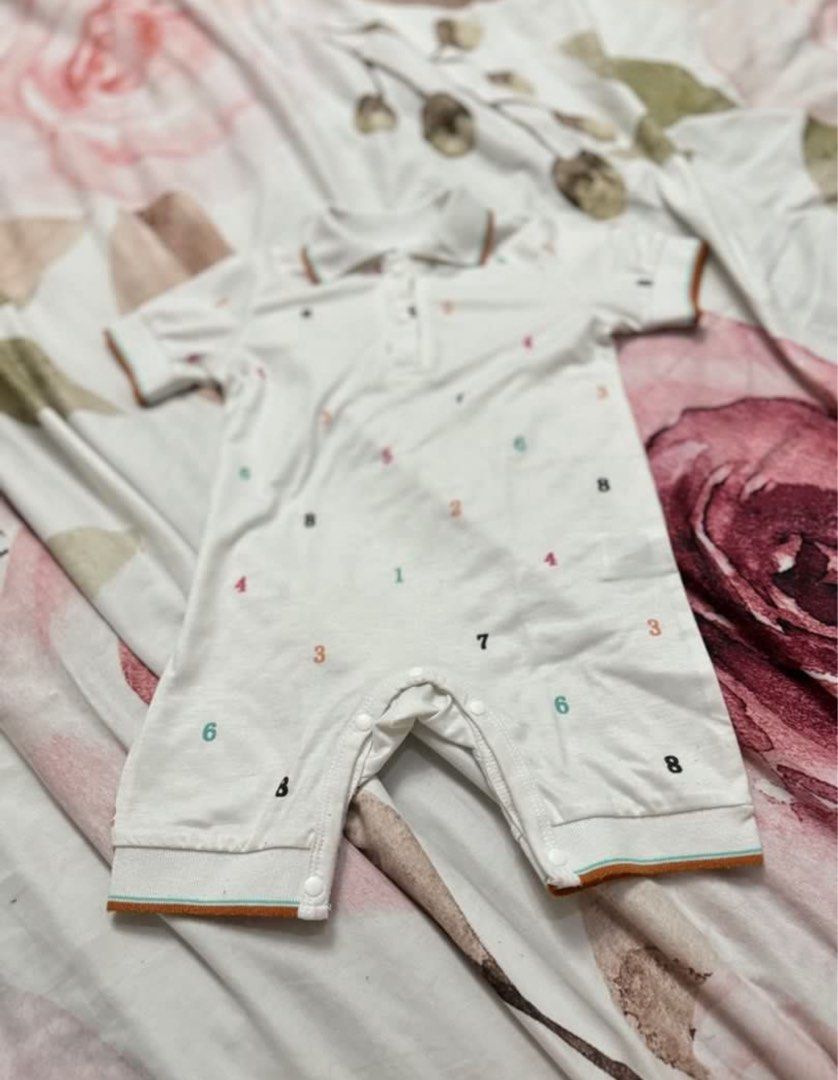 White Baby Romper with Number Print, Collared (Category: Babies & Kids Fashion) located in Santa Maria. Submitted by js.declutters (Listing ID 1446757313, Image 2). Description: - fits 6-12 mos - white baby romper - Fun number print design - Short sleeves and classic polo collar - Convenient snap closure for easy diaper changes -Daily wear or special occasions.