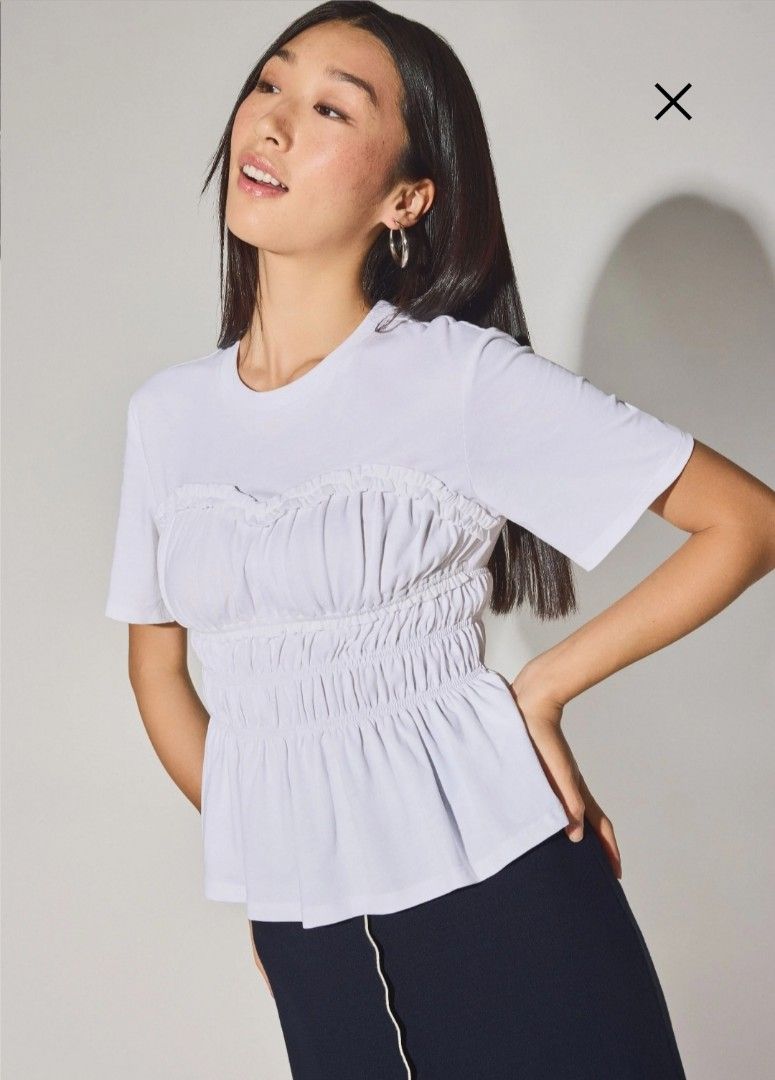 White Ruched Peplum Top (Category: Sleeveless) located in Manila. Submitted by mscloudnine (Listing ID 1446798804, Image 2). Description: - White short-sleeve top - Ruched detailing at bust and waist - Flattering peplum hem - Easy to style with skirts or pants - Suitable for casual or dressy occasions -100% cotton Retails for 2,290.00 Selling as low as 1,649.00 BRANDNEW with tag.