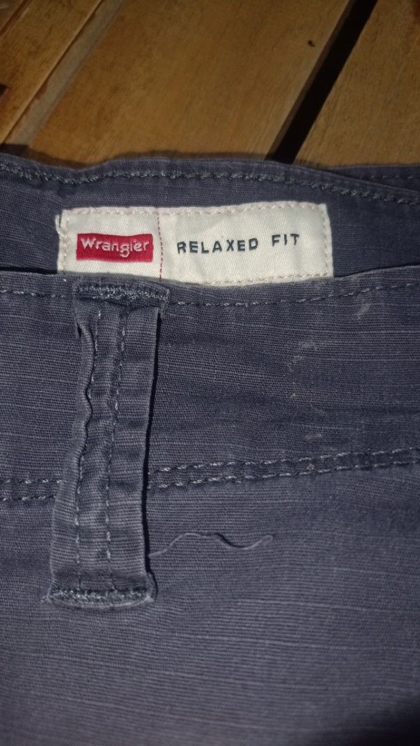 Wrangler Relaxed Fit Cargo Shorts (Category: Shorts) located in Manila. Submitted by deblong_ (Listing ID 1446893565, Image 2). Description: - Brand: Wrangler - Fit: Relaxed - Color: Dark Blue/Grey - Style: Cargo Shorts - Features: Multiple pockets for ample storage - Material: Durable fabric - Ideal for: Casual wear, outdoor activities - Benefits: Comfortable and practical.