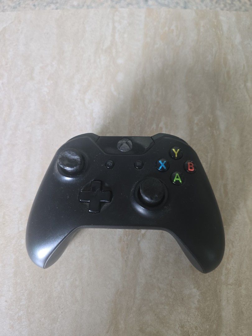 Xbox One Controller (Category: Xbox) located in Singapore. Submitted by reliableg (Listing ID 1446733396, Image 1). Description: - Genuine Xbox One Controller - Color: Black - Condition: Good, fully functional - Standard button layout - Ergonomic design for comfortable grip.