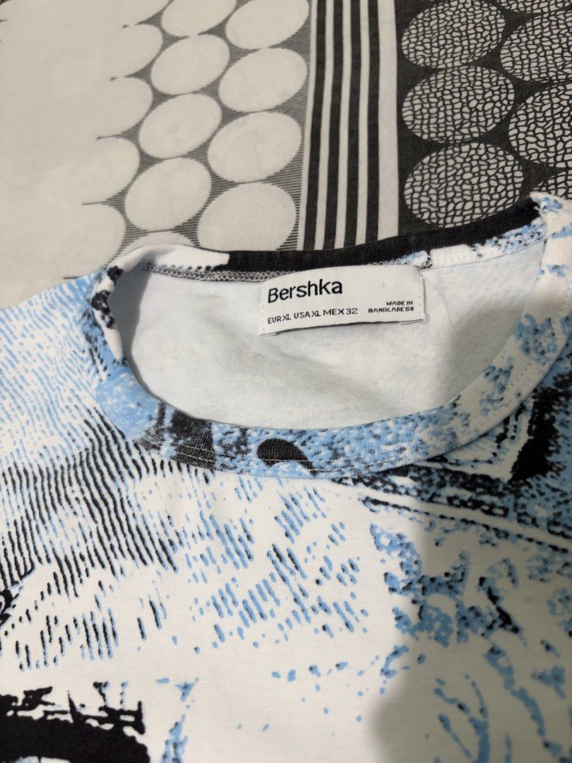 y2k tops bundle (Bershka & Shein) (Category: Shirts) located in Santo Tomas. Submitted by ymm0210 (Listing ID 1446824923, Image 3). Description: STILL GOOD AS NEW NO FLAWS - Bundle includes 2 y2k tees. - Bershka tee: Blue and black abstract design. - Shein tee: Textured brown and green tie-dye pattern. - Both are short-sleeved with crew necks. - Ideal for casual everyday wear. .
