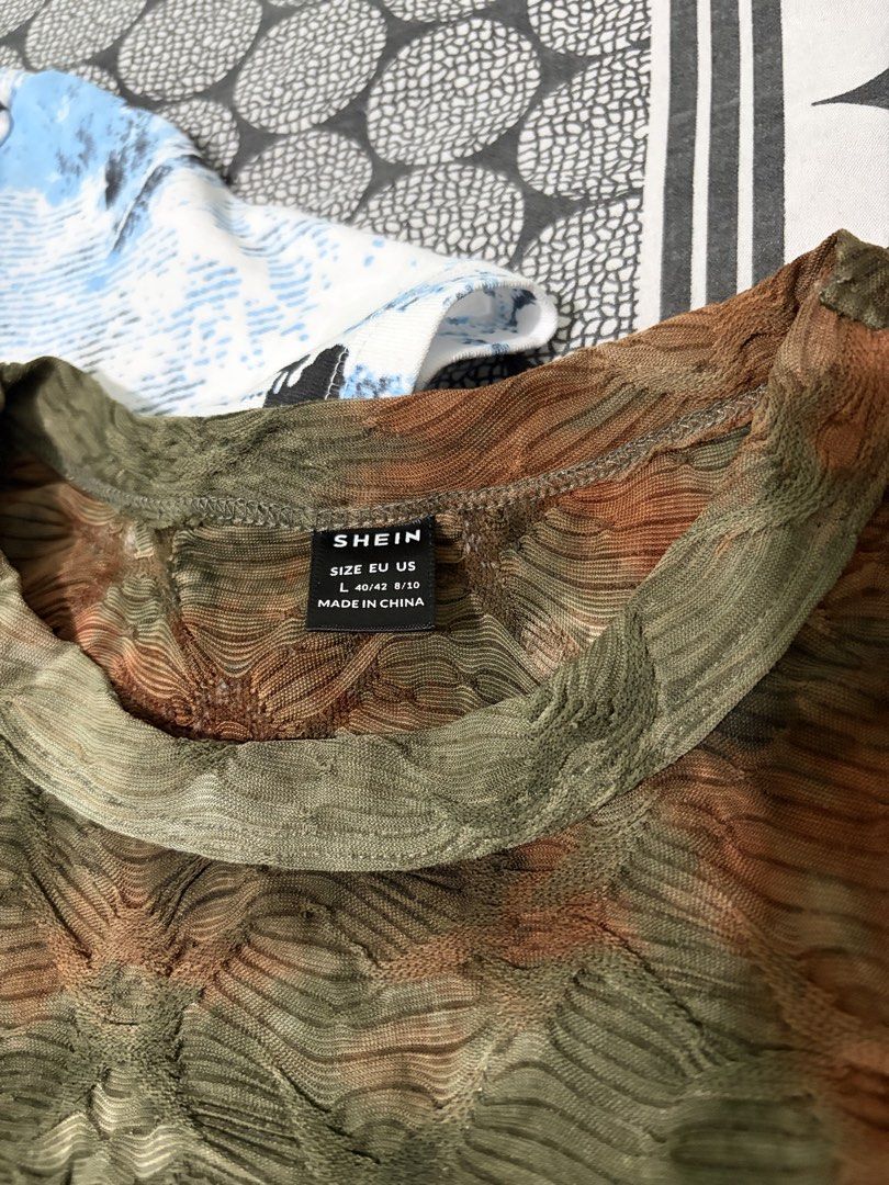 y2k tops bundle (Bershka & Shein) (Category: Shirts) located in Santo Tomas. Submitted by ymm0210 (Listing ID 1446824923, Image 2). Description: STILL GOOD AS NEW NO FLAWS - Bundle includes 2 y2k tees. - Bershka tee: Blue and black abstract design. - Shein tee: Textured brown and green tie-dye pattern. - Both are short-sleeved with crew necks. - Ideal for casual everyday wear. .