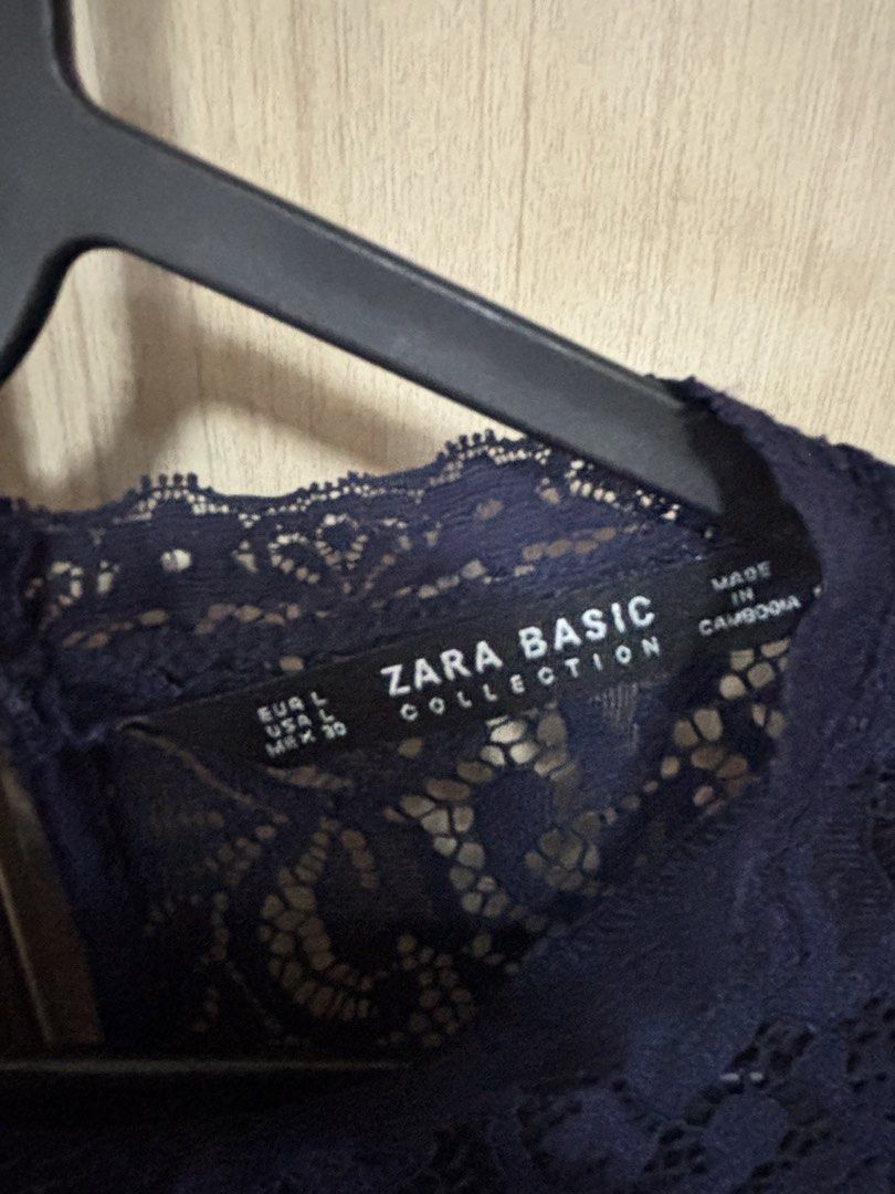 Zara Basic Collection Navy Lace Long Sleeve Top Size L (Category: Blouses) located in Pasig City. Submitted by nina.declutter (Listing ID 1446845115, Image 2). Description: - Zara Basic navy blue lace top - Long sleeves with flared cuffs - Intricate lace pattern - Button closure at the back neck - Perfect for dressing up or down.