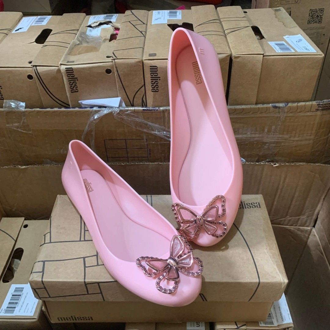 100% ORIGINAL & BRANDNEW MELISSA (Category: Flats & Sandals) located in Manila. Submitted by mydytrends (Listing ID 1441911559, Image 2). Description: PRICE IS NEGOTIABLE FOR SURE BUYER SIZE AVAILABLE - 8 9 10 - 100% Original & Brandnew Melissa flats - Color: Pastel Pink - Design: Features a charming butterfly embellishment with sparkling details - Material: Signature Melissa jelly material - Condition: Brand new - Style: Perfect for casual wear 