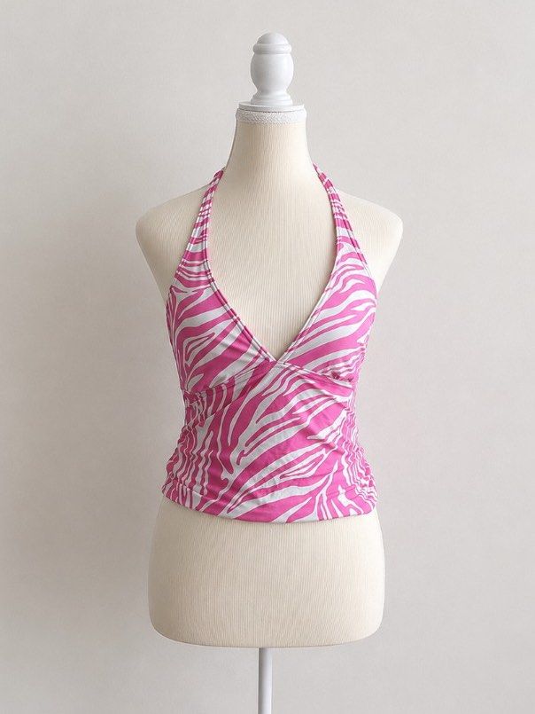 2000s Michael Kors Pink Zebra Print Halter Top (Category: Sleeveless) located in Pasig City. Submitted by declutterwithme_agb (Listing ID 1441777756, Image 1). Description: - Adorable pink and white zebra print halter top. - Halter neck with ties at the back. - Features ruched detailing on the sides. - Embellished with silver Michael Kors hardware at the hem. - Ideal for beach or pool wear..