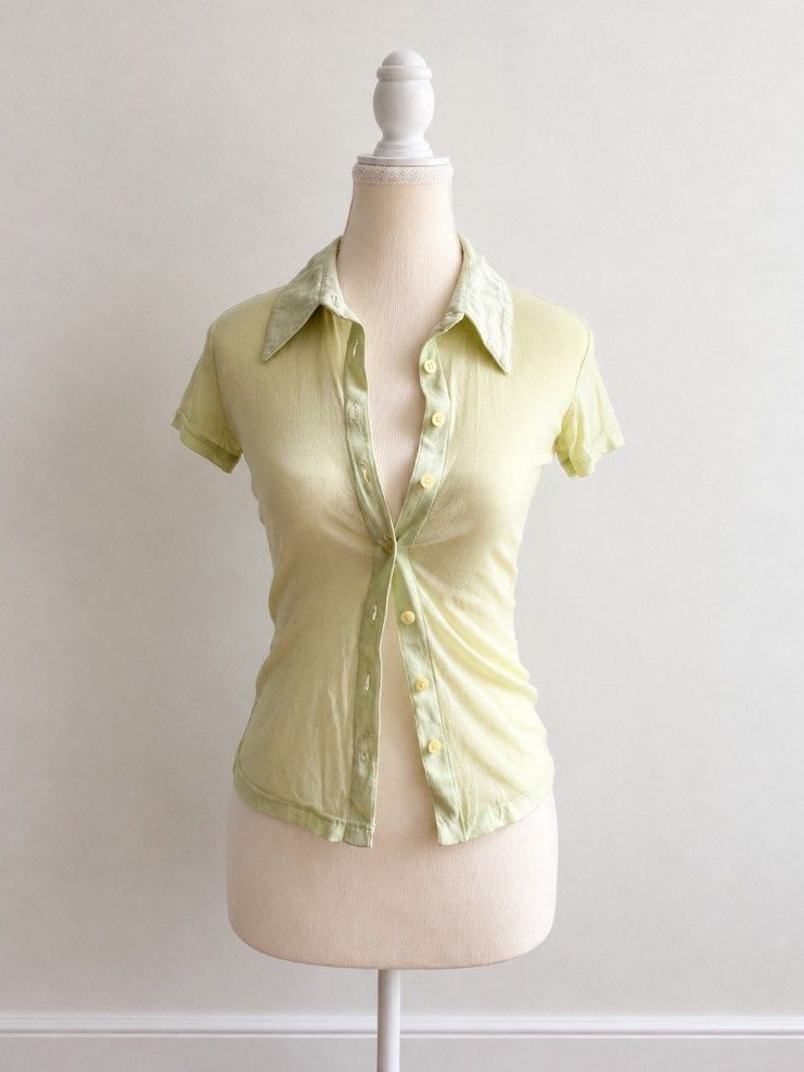 3 FOR 200 Miss Selfridge Light Green Button-Up Collared Top (Category: Blouses) located in Pasig City. Submitted by declutterwithme_agb (Listing ID 1441777875, Image 1). Description: - Light green collared top - Brand: Miss Selfridge - Short sleeves - Button-up front - Fabric has a slight sheen - Can be worn alone or layered - Suitable for casual or dressed-up occasions.