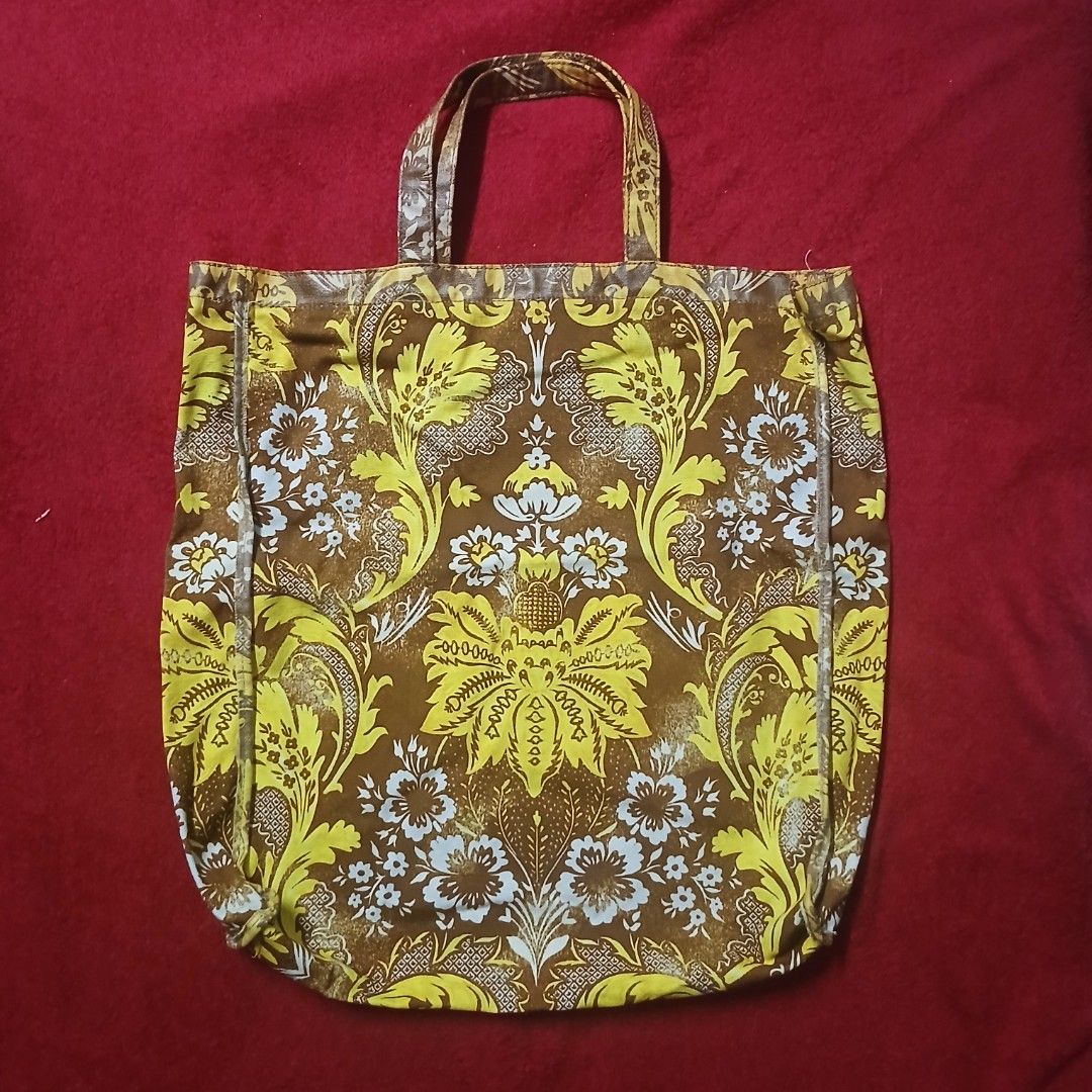 Acne Studios Brown Yellow Floral Print Tote Bag (Category: Tote Bags) located in Manila. Submitted by susanthrifts (Listing ID 1441945788, Image 3). Description: - Acne Studios tote bag - Features a brown and yellow floral print - Made from 100% cotton - Hand wash only - Ideal for everyday use - Please check photos for detailed condition.