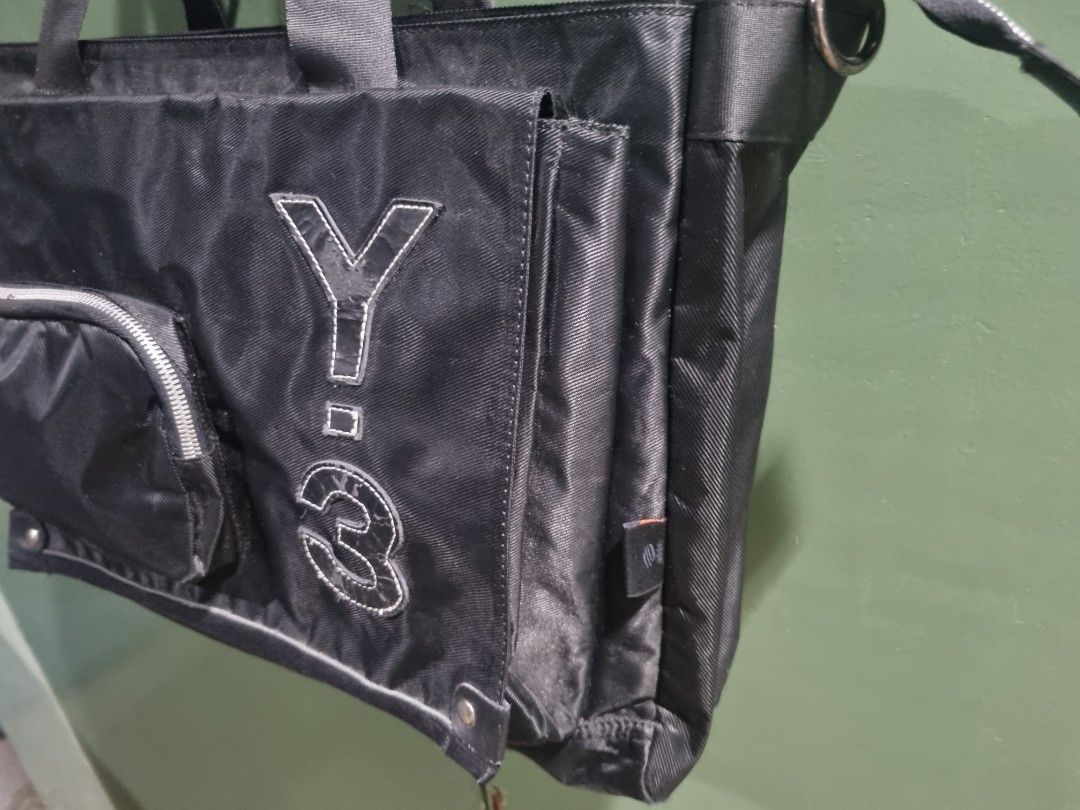Adidas Y-3 Yohji Yamamoto Utility Travel Bag (Category: Tote Bags) located in Manila. Submitted by thrift.mercato (Listing ID 1441879414, Image 2). Description: Adidas Y-3 Yohji Yamamoto Utility Travel Bag. Late 2000s release. Good condition, all fine stitchings, w/ minimal scratches and signs of minimal usage. One big pocket in front, one small pocket in front and side. Two pockets inside the bag. Polyamide Nylon Material. Issues: Minimal scratc