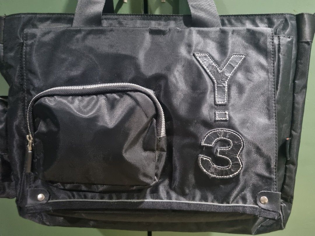 Adidas Y-3 Yohji Yamamoto Utility Travel Bag (Category: Tote Bags) located in Manila. Submitted by thrift.mercato (Listing ID 1441879414, Image 3). Description: Adidas Y-3 Yohji Yamamoto Utility Travel Bag. Late 2000s release. Good condition, all fine stitchings, w/ minimal scratches and signs of minimal usage. One big pocket in front, one small pocket in front and side. Two pockets inside the bag. Polyamide Nylon Material. Issues: Minimal scratc