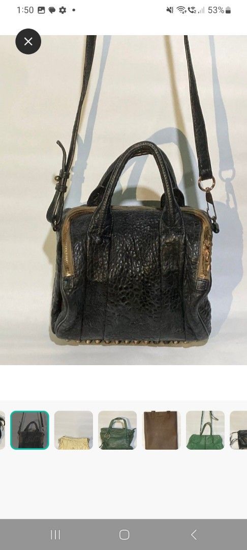 Alexander Wang Black Pebbled Leather Rocco Duffel Bag (Category: Luxury Bags & Wallets) located in Quezon City. Submitted by gwearsprada (Listing ID 1441829120, Image 1). Description: - Black pebbled leather Rocco duffel bag - Top handles and detachable shoulder strap - Signature studs on the bottom - Side zippers - Spacious interior for essentials - Ideal everyday bag.