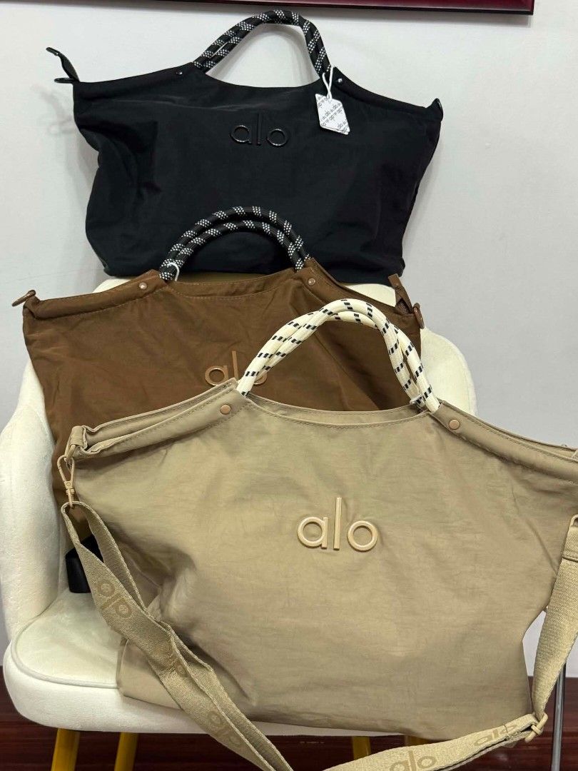 Alo tote bags 2way (Category: Tote Bags) located in Manila. Submitted by rcwessential (Listing ID 1441061083, Image 1). Description: This black Alo Yoga tote bag features distinctive braided rope handles and a subtle embroidered logo. [1, 2].
