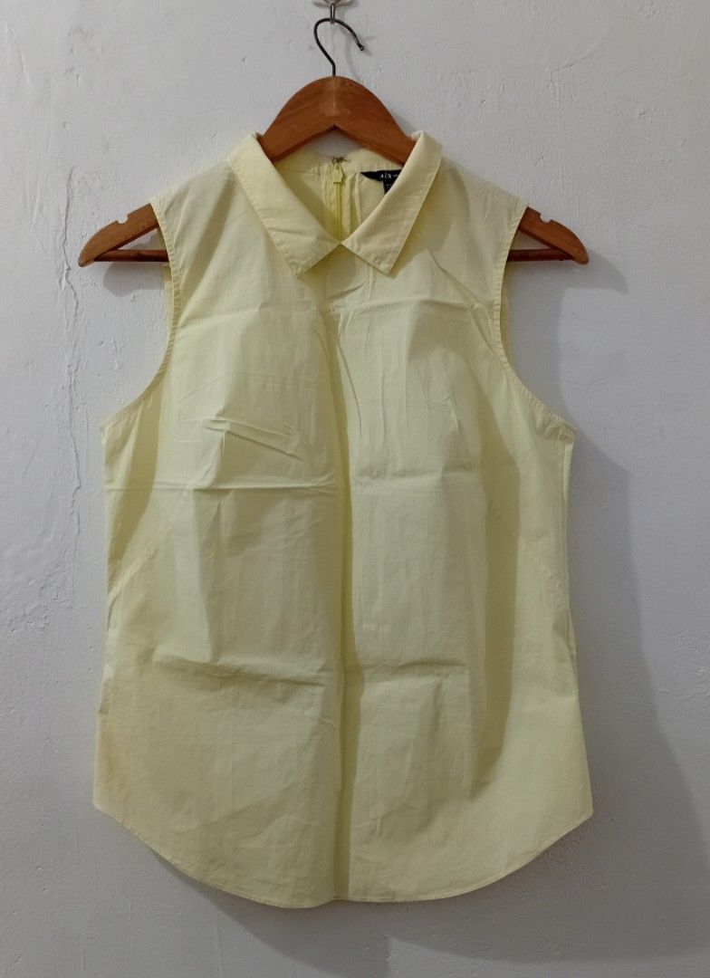 Armani Exchange Sleeveless Collared Top M/M Yellow (Category: Sleeveless) located in Navotas City. Submitted by ms.soulana (Listing ID 1441830106, Image 1). Description: PREOWNED LikeNew Lightly Used Authentic ARMANI EXCHANGE BABY COLLAR YELLOW TOPS YELLOW SMALL -MEDIUM Good Condition 9/10.