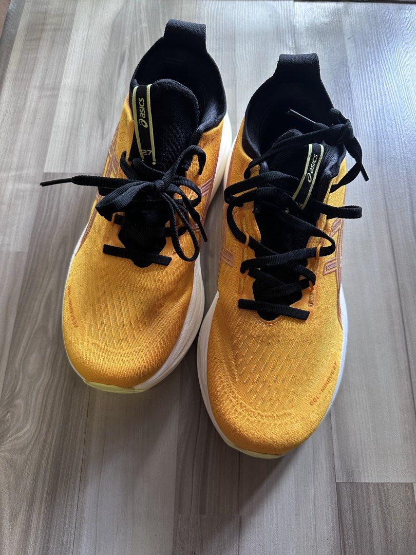 ASICS GEL-NIMBUS 27 Yellow Running Shoes (Category: Sneakers) located in Singapore. Submitted by dao0407 (Listing ID 1441925357, Image 1). Description: - ASICS GEL-NIMBUS 27 Running Shoes - Color: Yellow with black laces/interior and white sole with yellow accents - Condition: like new, wear 3 times only - Versatile: Perfect for running or everyday wear.
