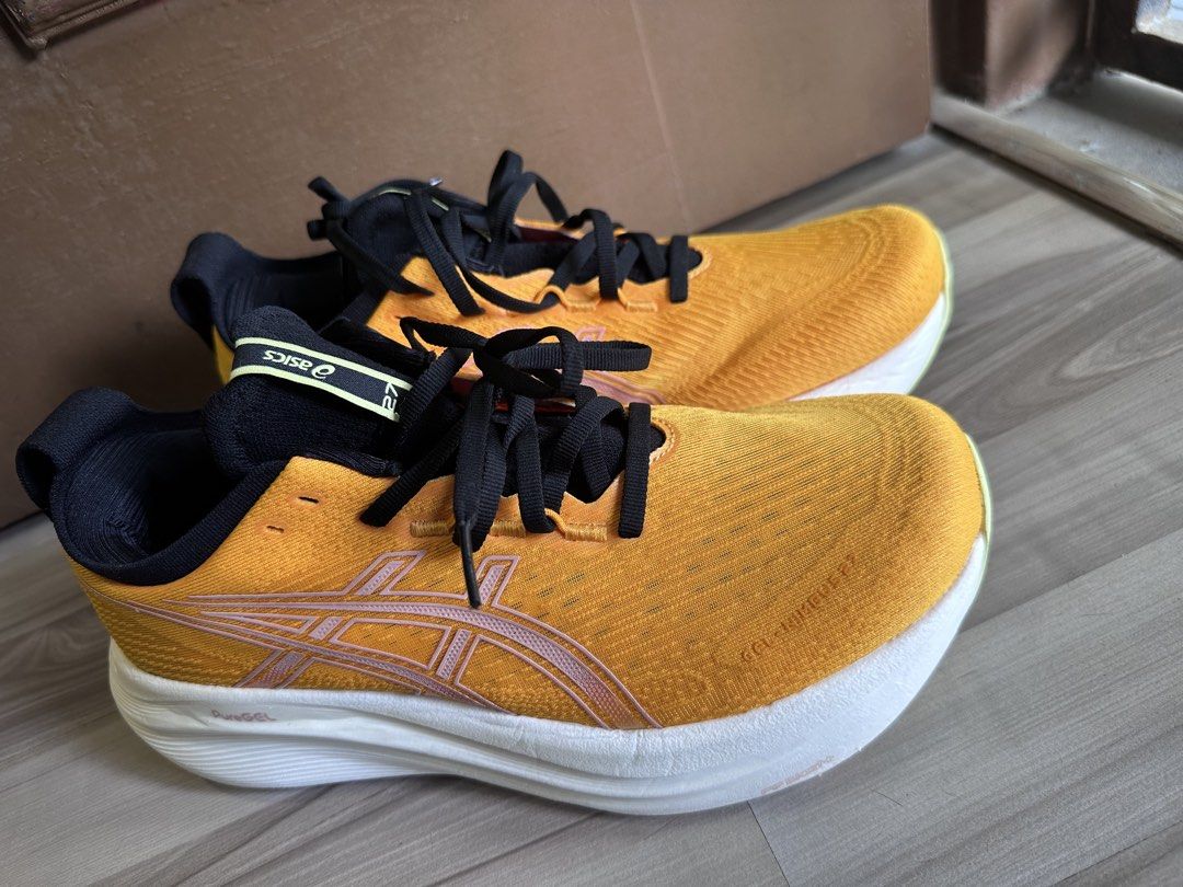 ASICS GEL-NIMBUS 27 Yellow Running Shoes (Category: Sneakers) located in Singapore. Submitted by dao0407 (Listing ID 1441925357, Image 3). Description: - ASICS GEL-NIMBUS 27 Running Shoes - Color: Yellow with black laces/interior and white sole with yellow accents - Condition: like new, wear 3 times only - Versatile: Perfect for running or everyday wear.