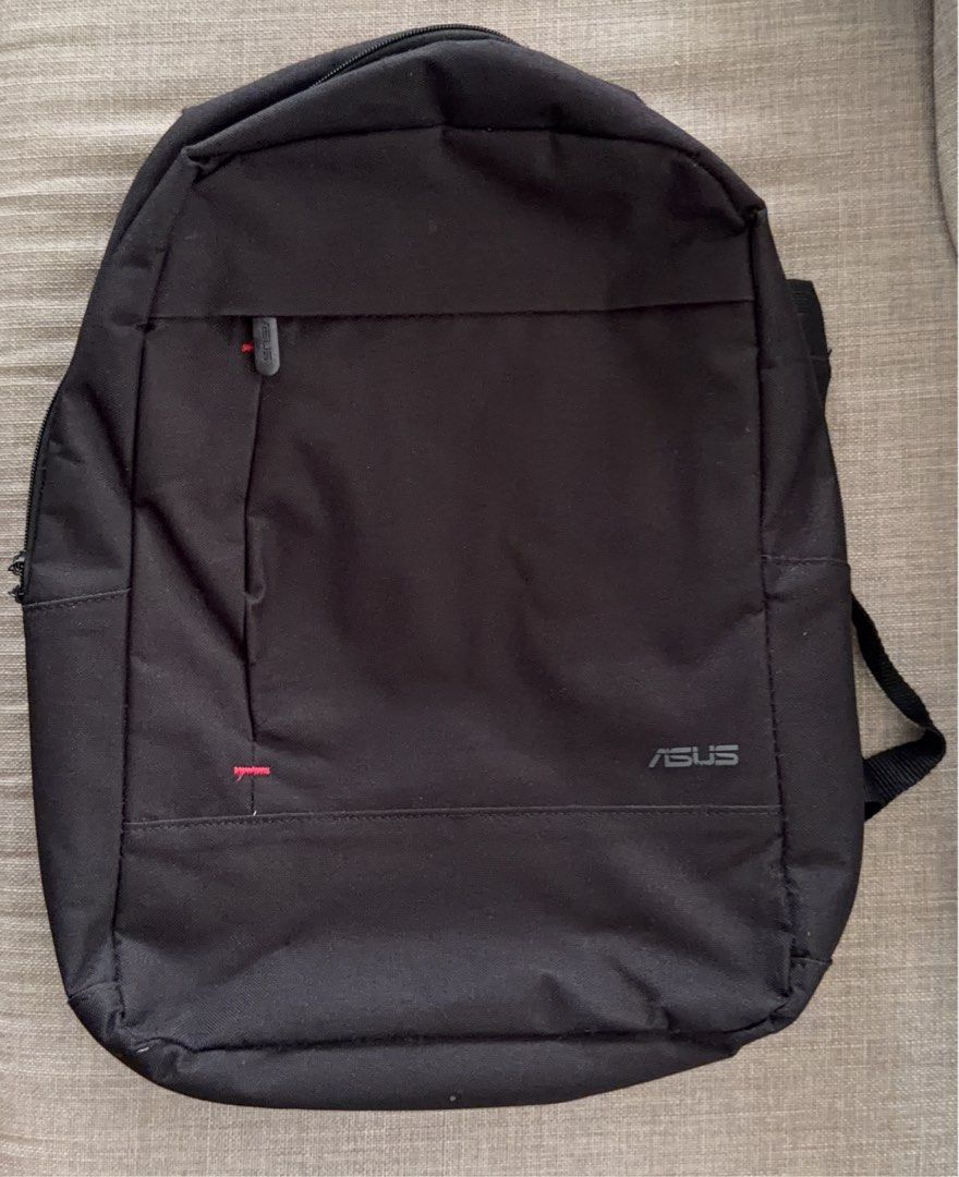 ASUS Black Backpack (Category: Backpacks) located in Antipolo. Submitted by lottientottie (Listing ID 1441850871, Image 1). Description: - Black ASUS backpack - Front zip pocket with red accent - Padded shoulder straps for comfort - Spacious interior - Ideal for everyday use or travel - Zippers in good working condition.