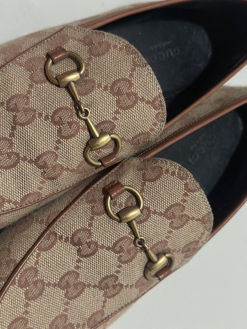 Authentic Gucci Jordaan Monogram Canvas Loafers (Category: Loafers) located in Paranaque City. Submitted by j.cwl (Listing ID 1441877439, Image 2). Description: -Authentic Gucci Jordaan Canvas Loafers - Beige GG monogram canvas with brown leather trim - Made in Italy - Soles show some wear from use - Size 37.5 - No inclusions *negotiable*.