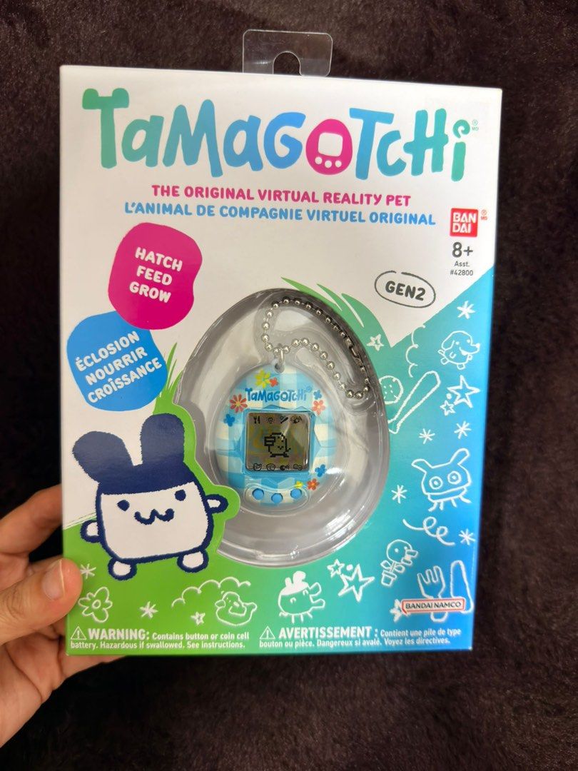 Bandai Tamagotchi Gen 2 Virtual Pet (Category: Interactive Toys) located in Singapore. Submitted by wisedeer.e17e2f (Listing ID 1441937895, Image 3). Description: - Gen 2 Tamagotchi Virtual Pet - Classic Hatch, Feed, Grow Gameplay - Comes in Original Packaging - Ideal for Collectors & Retro Toy Enthusiasts - Bandai Namco Product.