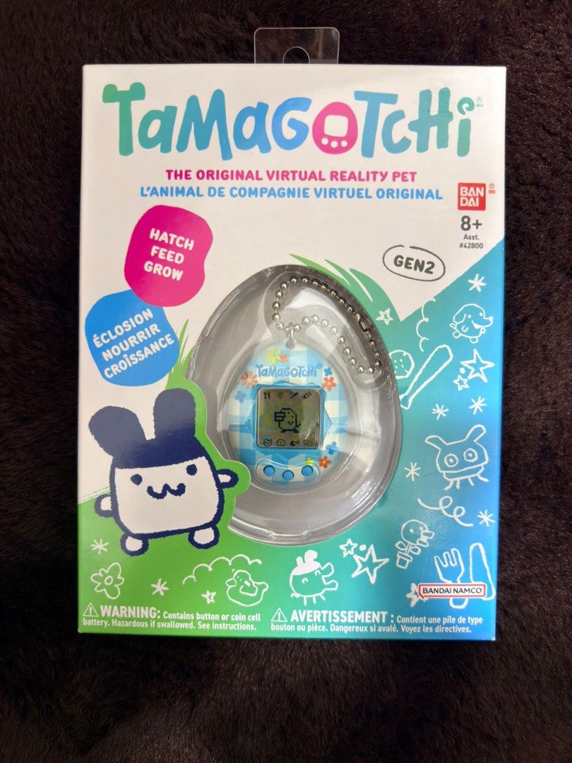Bandai Tamagotchi Gen 2 Virtual Pet (Category: Interactive Toys) located in Singapore. Submitted by wisedeer.e17e2f (Listing ID 1441937895, Image 1). Description: - Gen 2 Tamagotchi Virtual Pet - Classic Hatch, Feed, Grow Gameplay - Comes in Original Packaging - Ideal for Collectors & Retro Toy Enthusiasts - Bandai Namco Product.