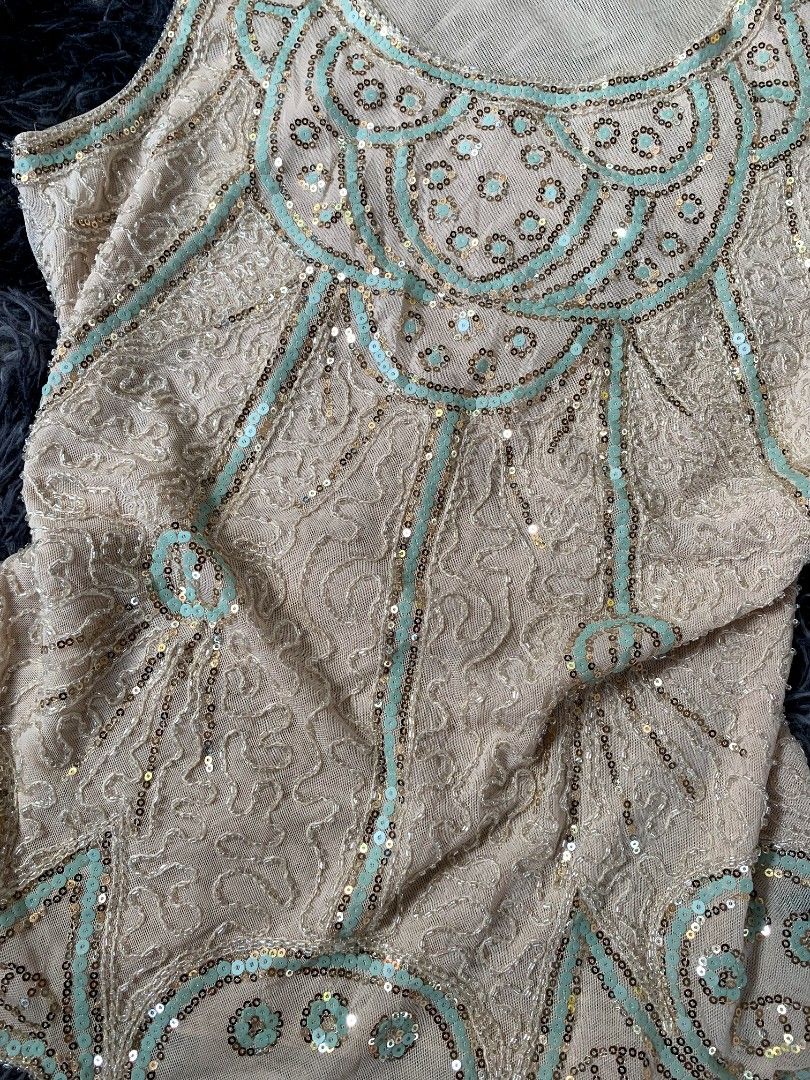 Beaded Sequin Flapper Top - Gatsby Style (Category: Sleeveless) located in Bislig. Submitted by styleeee (Listing ID 1441865524, Image 3). Description: - medium-large - Cream sleeveless top - Intricate beadwork and sequin embellishments - 1920s flapper-inspired style .