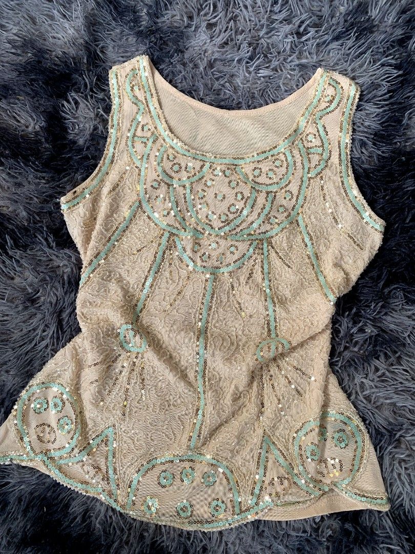 Beaded Sequin Flapper Top - Gatsby Style (Category: Sleeveless) located in Bislig. Submitted by styleeee (Listing ID 1441865524, Image 2). Description: - medium-large - Cream sleeveless top - Intricate beadwork and sequin embellishments - 1920s flapper-inspired style .