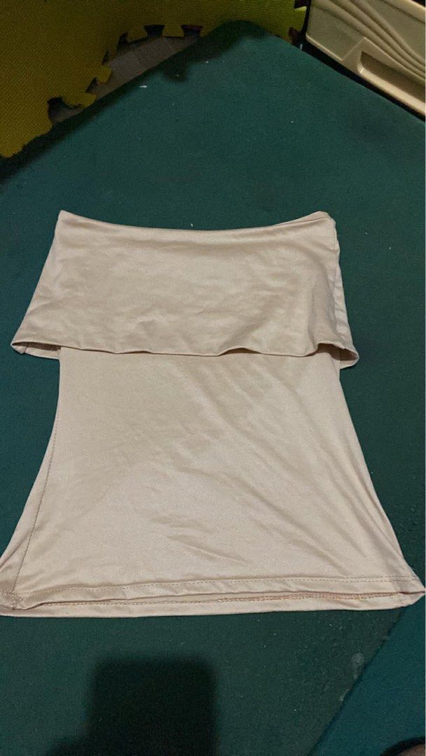 Beige Off-Shoulder Tube Top (Category: Others Tops) located in Manila. Submitted by andy.cc (Listing ID 1441907040, Image 1). Description: Simple beige tube top. Off-shoulder design with a ruffled band at the top. Stretchy material. Good condition .
